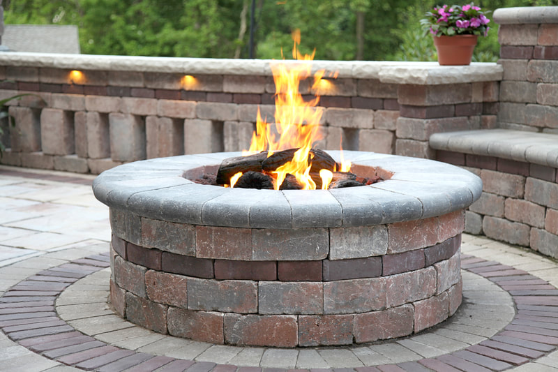 firepits with custom patios, walls, and lighting