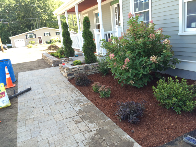 stone walkways, planters, steps, and landscaping